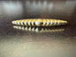 Monet brooch, signed Monet, gold tone Scalloped with tapered ends, 1980’s